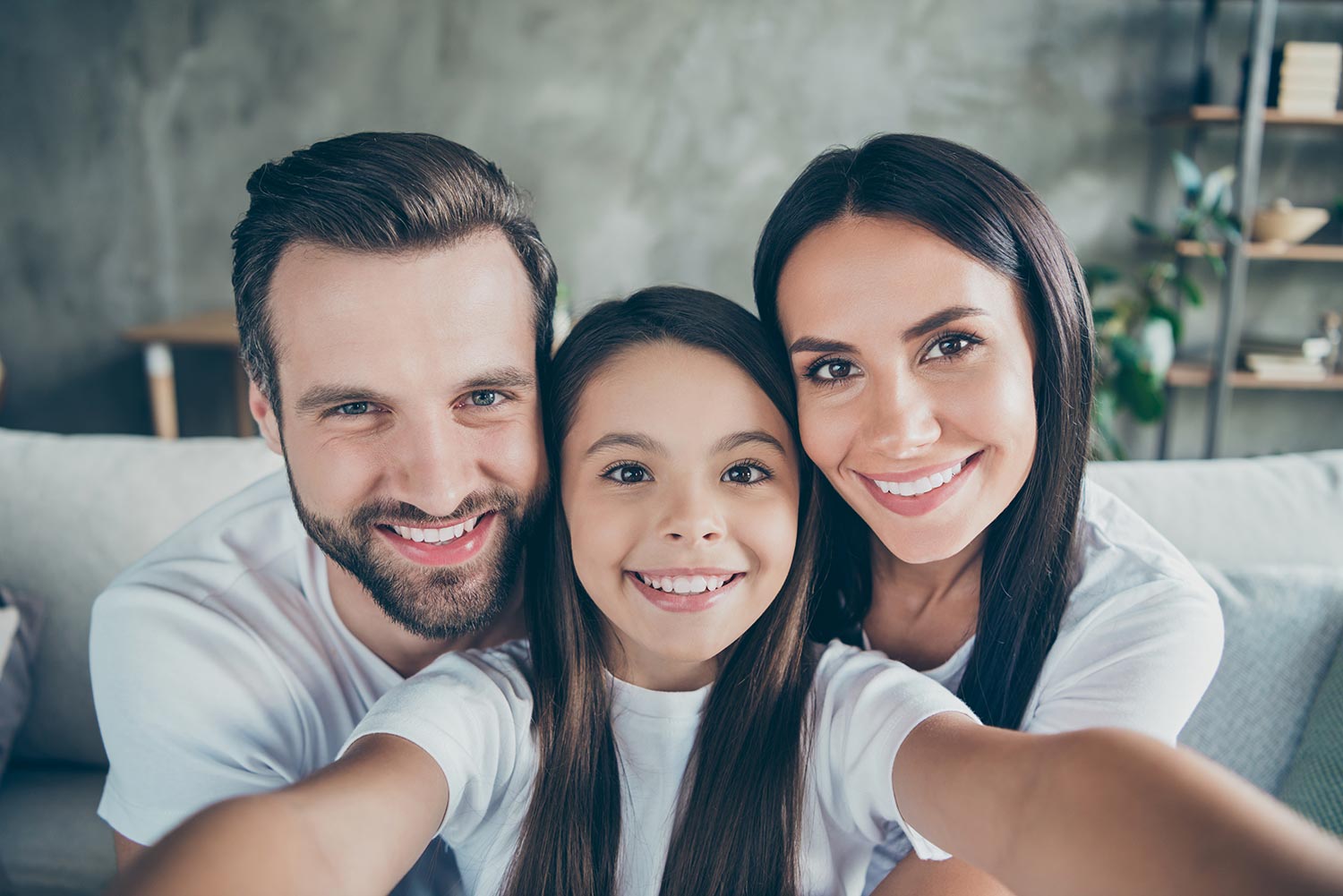 image of parents with adopted child.